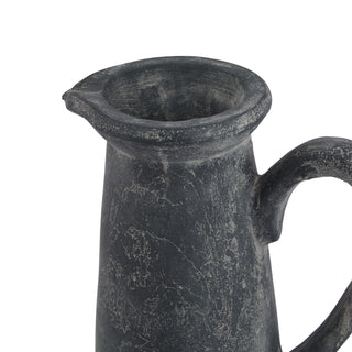 close up of black stone tall jug