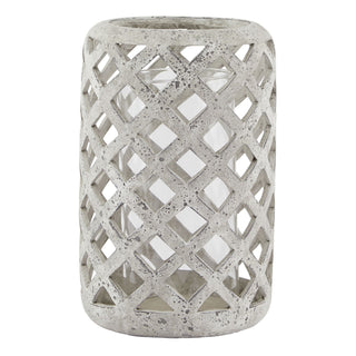 A beige stone hurricane lantern with a geometric pattern design, intended for holding candles.