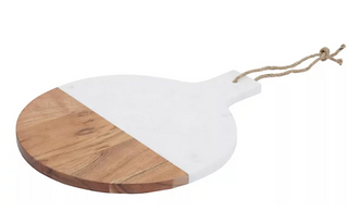Marble and wooden chopping board that has a handle resembling a rope tied to the edge.