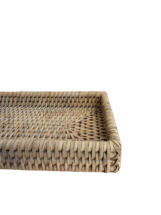 Woven rattan tray on a white background