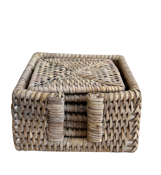 Woven rattan box with lid on a white background
